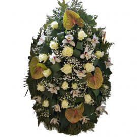 A funeral wreath of anthuriums, roses and orchids