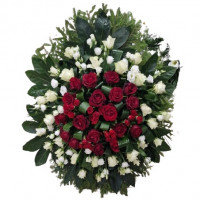 Funeral wreath of red roses and lisianthus